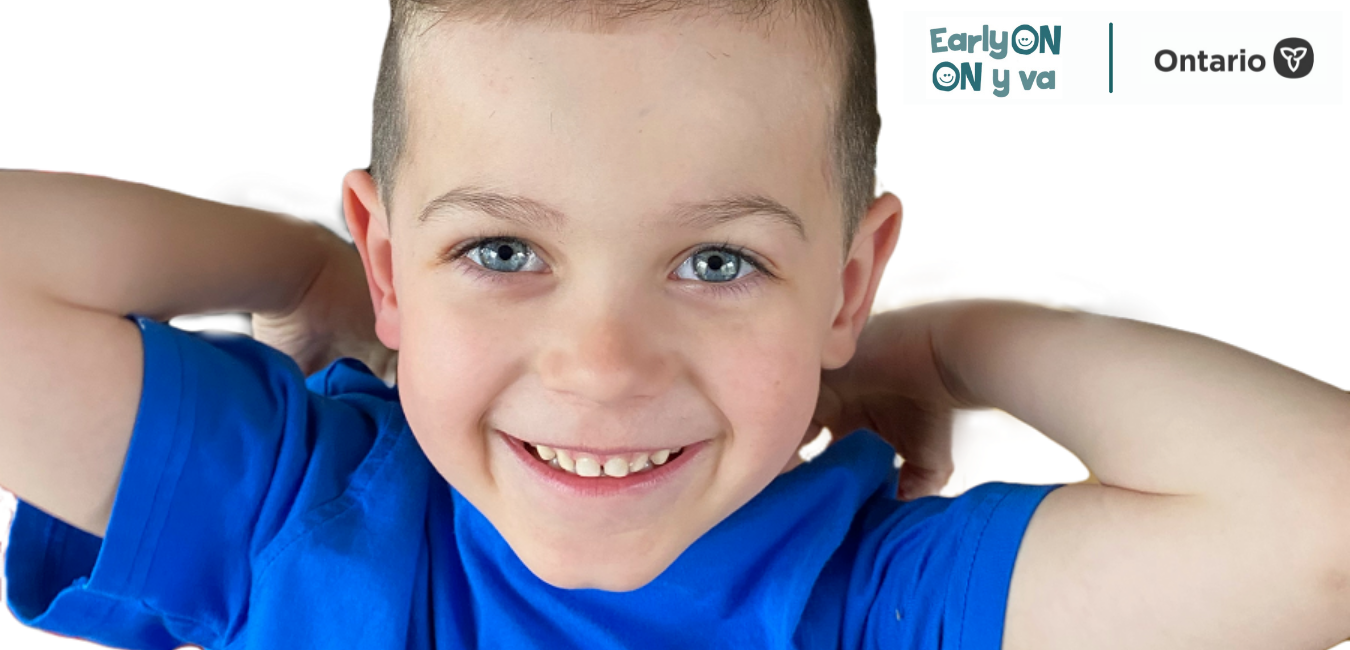 Boy smiling into the camera, and logos for EarlyON and Ontario